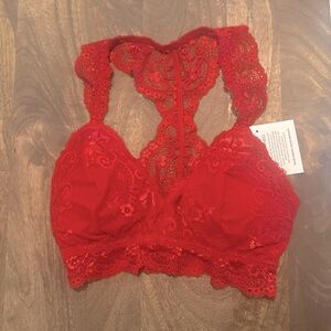Lace bralette with a racerback and cups for support. Sexy and comfortable.